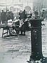 Piazza dei Frutti con una foto del 1965 di Giovanni Umicini (Fabio Fusar)